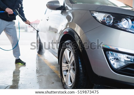 Car washing. Cleaning Car Using High Pressure Water.