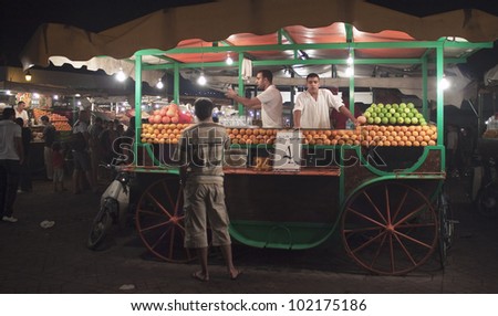 MARRAKESH, MOROCCO - AUGUST 7: Unidentified people visit stalls with juices at the Jema el Fna Square on August 7, 2010 in Marrakesh, Morocco. The square is part of the UNESCO World Heritage.