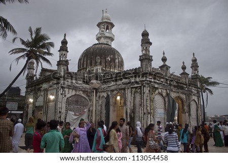 MUMBAI INDIA SEPTEMBER 6 Devottes at Haji Ali Mosque on September 6 2011 in Mumbai India Mosque was constructed in 1431 in memory of a rich Muslim merchant. MUMBAI INDIA SEPTEMBER 6 Devottes at Haji Ali Mosque on September 6 2011 in Mumbai India Mosque was constructed in 1431 in memory of a rich Muslim merchant.