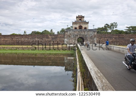 HUE, VIETNAM - JULY 31: Traffic on a bridge over Citadel moat on July 31, 2012 in Hue, Vietnam. Citadel in Hue is enlisted in UNESCO World Heritage Sites.