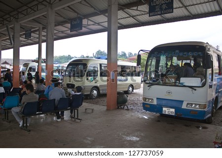 MUANG XAY, LAOS - AUGUST 15: Unidentified people at bus station in Muang Xay, Laos on August 15, 2012. There are many bus services to Luang Prabang, Nong Khiaw, Phongsaly, Vientiane etc.