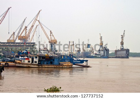 HAI PHONG, VIETNAM - AUGUST 4: Cargo ships in a port on August 4, 2012 in Hai Phong, Vietnam. Hai Phong port is one of the two biggest ports in Vietnam.