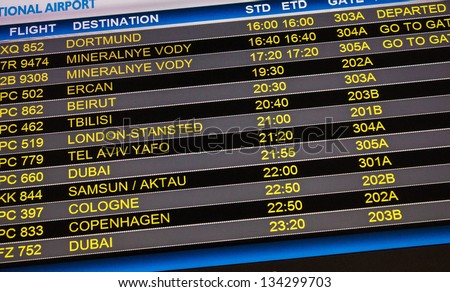 Flights departure information timetable in airport terminal