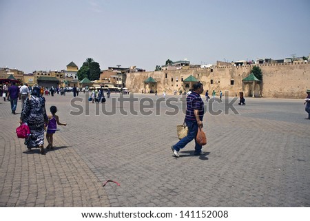 MEKNES, MOROCCO - JULY 28: Arabic people at famous El Hedim square on July 28, 2010 in Meknes, Morocco. Meknes is a historic city listed in UNESCO and it has long tradition in handicrafts.