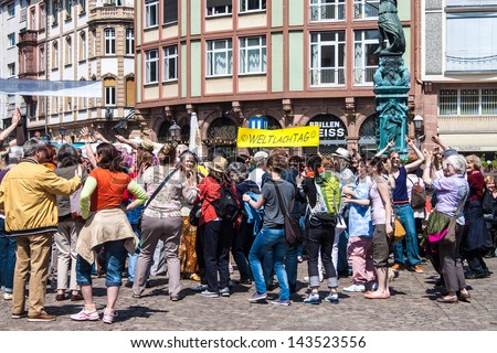 FRANKFURT, GERMANY - MAY 5: People celebrate World Laughter Day on Roemerberg square in Frankfurt, Germany on May 5, 2013. World Laughter Day takes place on the first Sunday of May of every year.