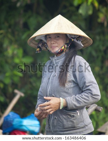 CAN THO, VIETNAM- JULY 24:Unidentified woman at Cai Rang Floating Market in Can Tho, Vietnam on July 24, 2012. Cai Rang Market is the biggest floating market in the Mekong Delta