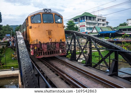 KANCHANABURI, THAILAND - AUG 25: Train on the bridge over the river Kwai (Khwae) in Kanchanaburi, Thailand on Aug 25, 2013. This bridge is famous for its history in WW2.
