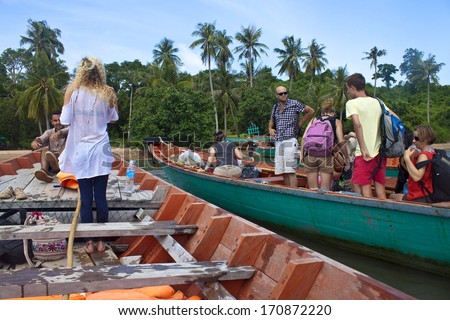 KOH TONSAY, CAMBODIA - JULY 23: Tourists on a boat on July 23, 2012 at Koh Tonsay island, Cambodia. Koh Tonsay is also called Rabbit Island.