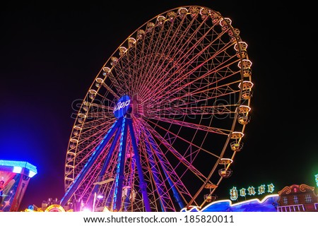 BONN, GERMANY - SEPTEMBER 11: Big ferris wheel at Putzchen fair on September 11, 2012 in Bonn, Germany. It is a traditional funfair founded in 1367.