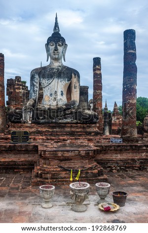 Buddha image at Wat Mahathat temple ruin in Sukhothai Historical Park, Thailand
