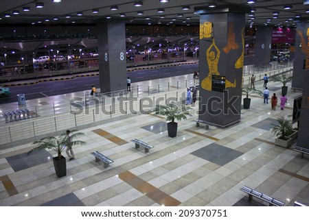 DELHI, INDIA - SEPTEMBER 14 : People travel through modern airport terminal on September 14, 2011 in Delhi, India. Delhi is the second most populous city in India and its capital.