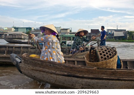 CAN THO, VIETNAM- JULY 24:Unidentified people at Cai Rang Floating Market in Can Tho, Vietnam on July 24, 2012. Cai Rang Market is the biggest floating market in the Mekong Delta