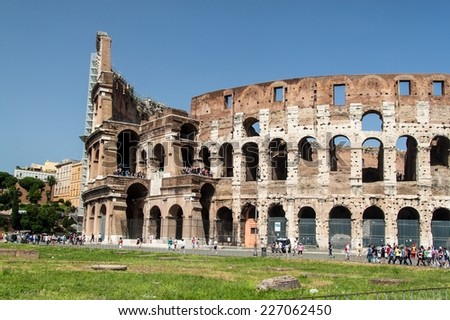 ROME - JUNE 24: Colosseum exterior on June 24, 2014 in Rome, Italy. The Colosseum is one of Rome\'s most popular tourist attractions with over 5 million visitors per year.