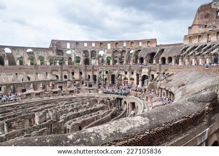 ROME - JUNE 25: Colosseum interior on June 25, 2014 in Rome, Italy. The Colosseum is one of Rome\'s most popular tourist attractions with over 5 million visitors per year.