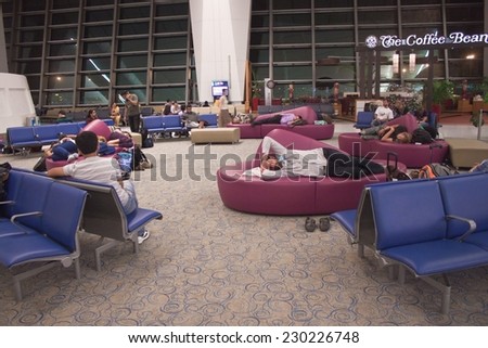 DELHI, INDIA - SEPTEMBER 14 : People wait at a modern airport terminal on September 14, 2011 in Delhi, India. Delhi is the second most populous city in India and its capital.