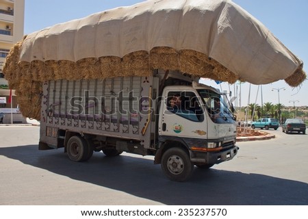 MEKNES, MOROCCO - JUL 29: Overloaded truck on Jul 29, 2010 in Meknes, Morocco. Meknes is a 1000 years old imperial city in Morocco.