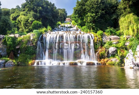 Artificial waterfall and statue at the garden of Palace of Caserta in southern Italy