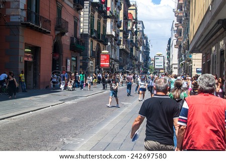 NAPLES, ITALY- JULY 1, 2014: Street in historic center of Naples, Italy. Naples historic city center is the largest in Europe, and is listed by UNESCO as a World Heritage Site.