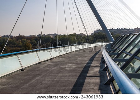 ZARAGOZA, SPAIN - NOVEMBER 1: Pedestrian bridge over Ebro river in Zaragoza, Spain on November 1, 2014. Bridge was built in 2008 for the international EXPO.