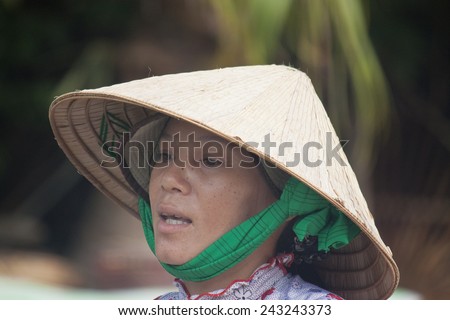 CAN THO, VIETNAM- JULY 24:Unidentified woman at Cai Rang Floating Market in Can Tho, Vietnam on July 24, 2012. Cai Rang Market is the biggest floating market in the Mekong Delta