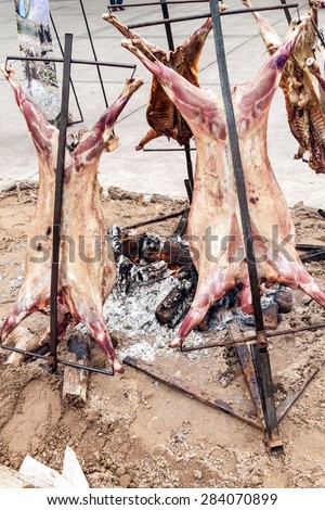 Traditional asado - barbecue of a lamb. Plaza Independecia square in Mendoza, Argentina.
