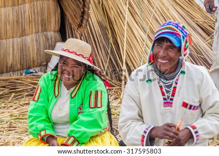 TITICACA, PERU - MAY 15, 2015: Inhabitants of Uros floating islands, Titicaca lake, Peru