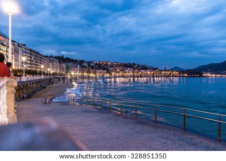 SAN SEBASTIAN, SPAIN - SEPTEMBER 28, 2014: View of a seaside promenade of San Sebastian, Basque Country, Spain. San Sebastian will be the European Capital of Culture in 2016.