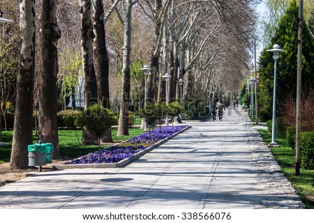 ISFAHAN, IRAN - MARCH 8: People enjoy a sunny day in a park in Isfahan, Iran on March 8, 2013.  Isfahan has a population of 1,583,609 and is Iran\'s third largest city after Tehran and Mashhad.