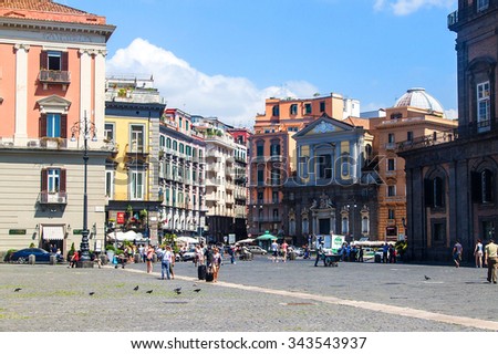 NAPLES, ITALY- JULY 1, 2014: Street in historic center of Naples, Italy. Naples historic city center is the largest in Europe, and is listed by UNESCO as a World Heritage Site.
