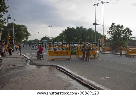 DELHI, INDIA - AUGUST 3: Police check-point on a street at August 3, 2011 in Old Delhi, India. Indian capital suffers from terrorism. There were attacks in 2001, 2005, 2007 and 2011.