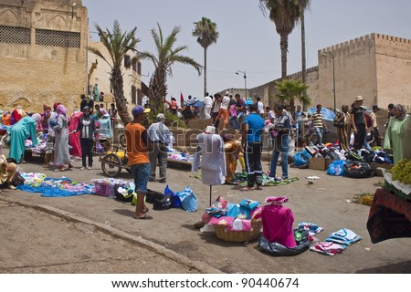 MEKNES, MOROCCO - JULY 28: Arabic people at a market on July 28, 2010 in Meknes, Morocco. Meknes is a historic city listed in UNESCO and it has long tradition in handicrafts.