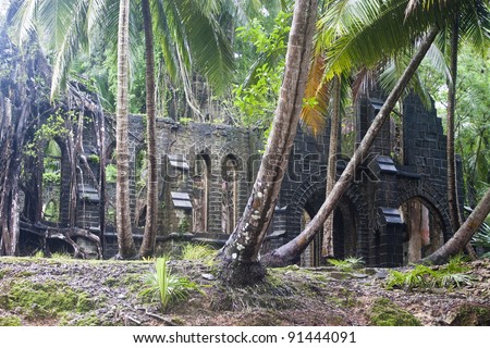 Ruin of abandoned church covered with roots on Ross Island. Andaman Islands, India