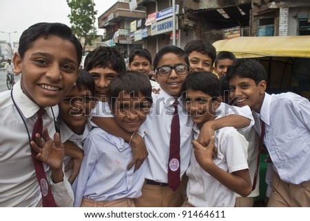 AHMEDABAD, INDIA - SEPTEMBER 7: Unidentified children in school uniforms at September 7, 2011 in Ahmedabad, India. Education has been made free for children for 6 to 14 years of age in India.