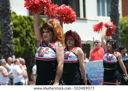 LONG BEACH - MAY 20: Men dressed as cheerleaders during the Long Beach Lesbian and Gay Pride Parade 2012 on May 20, 2012 in Long Beach, California.