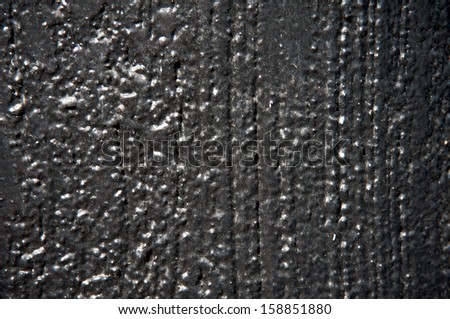Textured cement black painted background