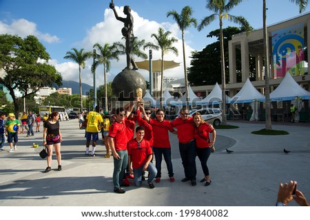 RIO DE JANEIRO, BRAZIL - JUNE 11: Mexican soccer fans holding a replica of the FIFA World Cup outside the Maracana stadium, one day before the FIFA World Cup started, on June 11, 2014.