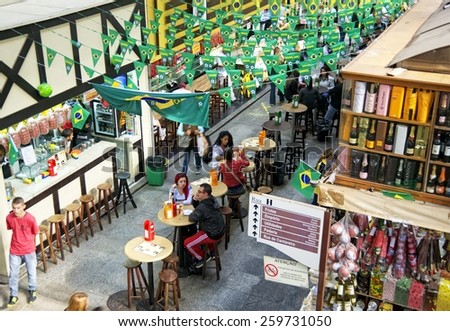 SAO PAULO, BRAZIL, JUNE 24, 2014: People eating at the world famous Central Market of Sao Paulo in Brazil during the 2014 FIFA World Cup. This landmark is a destination for tourists and locals.