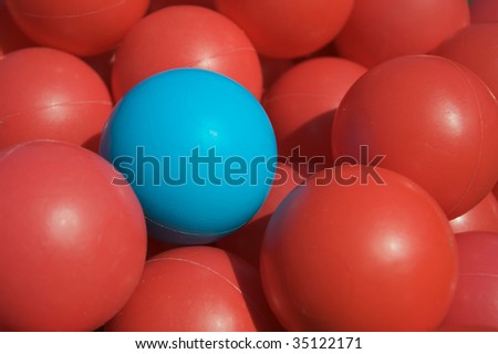 Blue ball among red balls