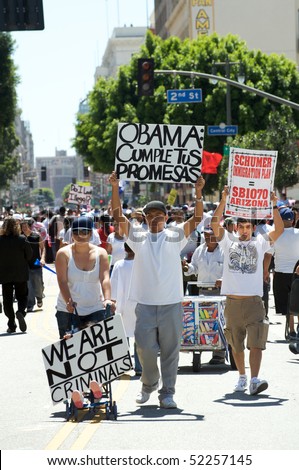 LOS ANGELES - MAY 1: On International Workers' Day, people march in Downtown on support to Arizona immigrants, gay rights and demand an immigration reform on May 1, 2010 in Los Angeles.