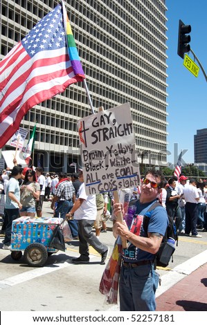 LOS ANGELES - MAY 1: On International Workers\' Day, people march in Downtown on support to Arizona immigrants, gay rights and demand an immigration reform on May 1, 2010 in Los Angeles.