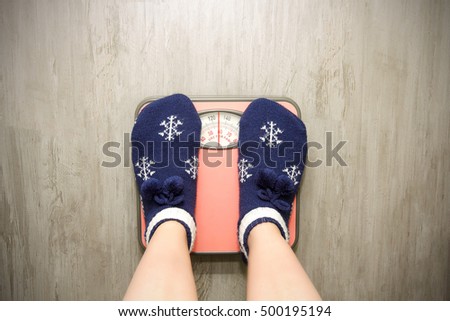 girl standing on floor vysah in Christmas socks