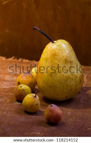 Pears on wooden table and background