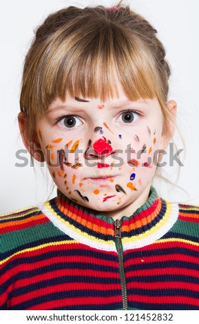 Funny little girl - colored hands and face