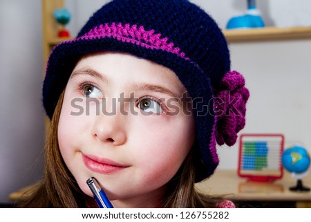 Portrait of a young girl thinking about school problem