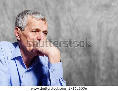 Worried elderly businessman