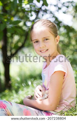 Cute little girl with a bunny rabbit