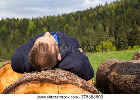 Young man resting in forest