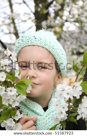 cute girl smell a flower