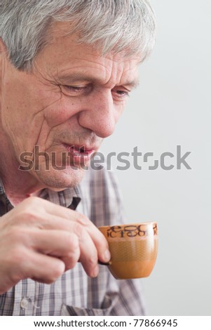 Older man drinking coffee and smoking - Hard Life