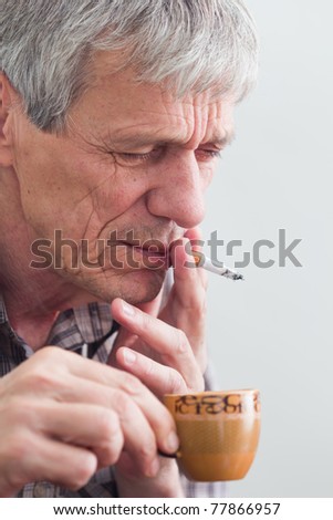 Older man drinking coffee and smoking - Hard Life